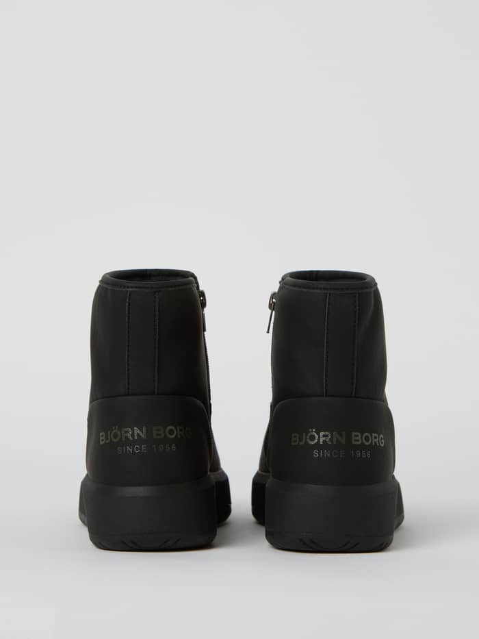 Women's Wooly Boots i sort syntetisk læder set bagfra med et sølvfarvet logo og en høj gummisål. - Image 3