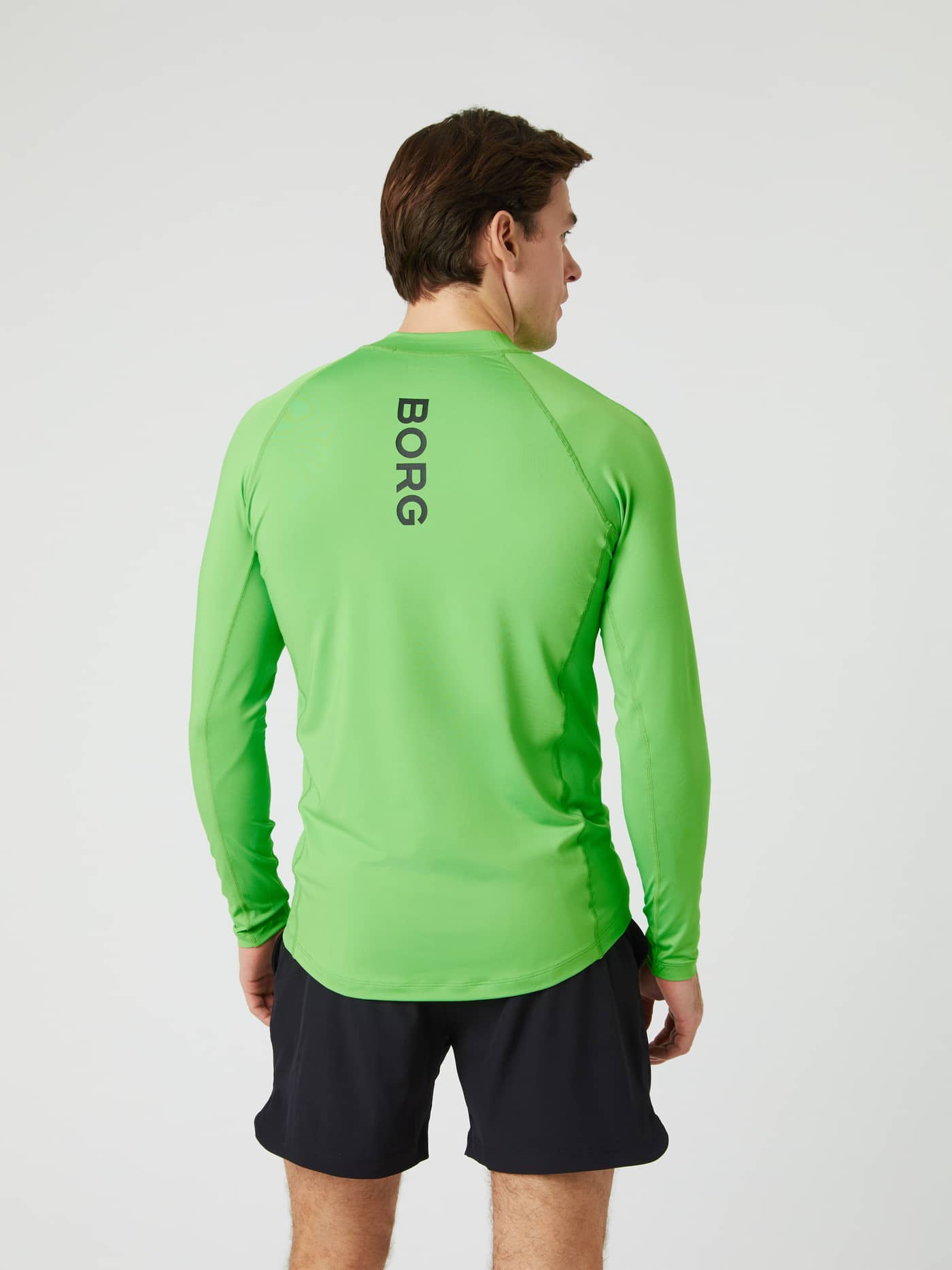 Man wearing the green Borg Mock Neck Long Sleeve T-shirt, pictured from behind to show the logo. - Image 3