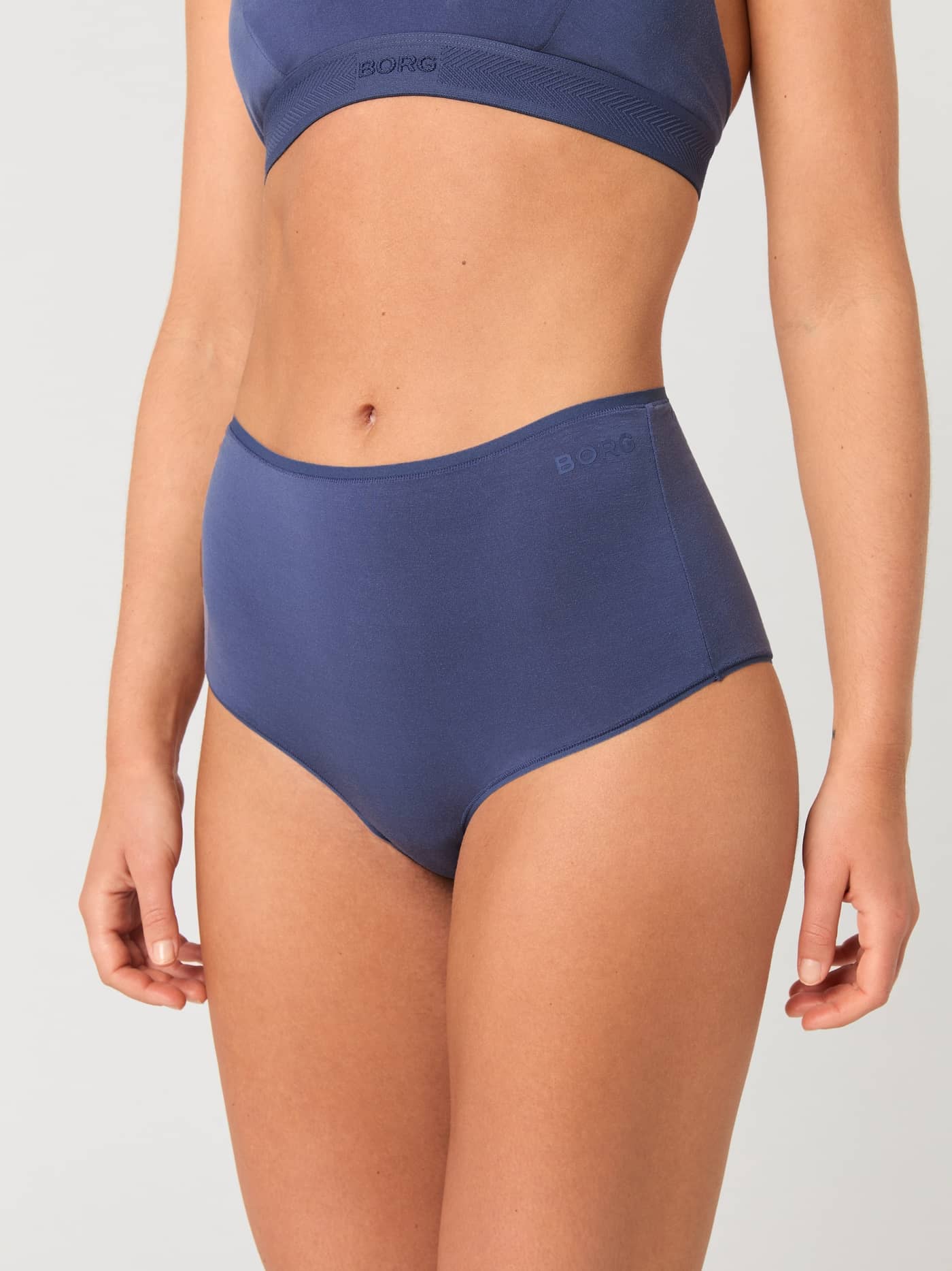 Front view of a model wearing the blue Björn Borg Core Lyocell Highwaist Brief 1-pack with a soft highwaist fit. - Image 1