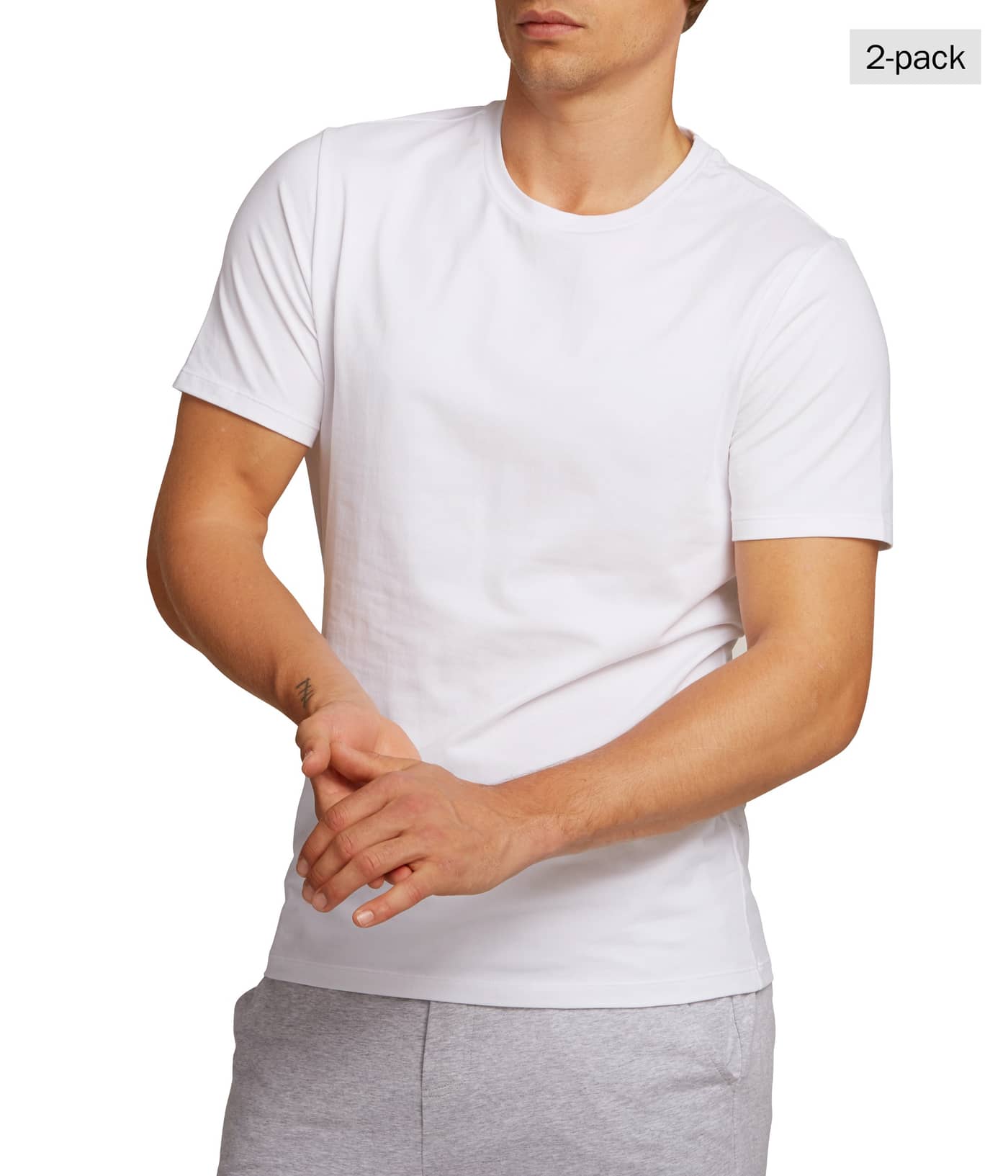 Front view of a man wearing the Björn Borg CORE FLANNEL SET 2p in Multi (Multi), with a white T-shirt and grey flannel pants. - Image 3