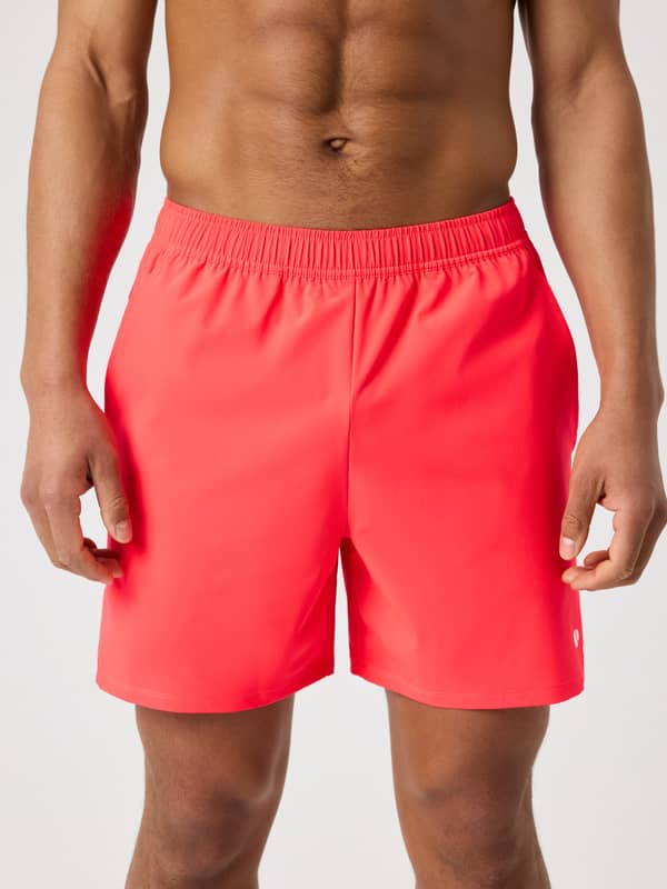 Front view of a man wearing the Björn Borg Ace Racquet Shorts 7 Inch in Diva Pink (Pink) for performance on the tennis court.