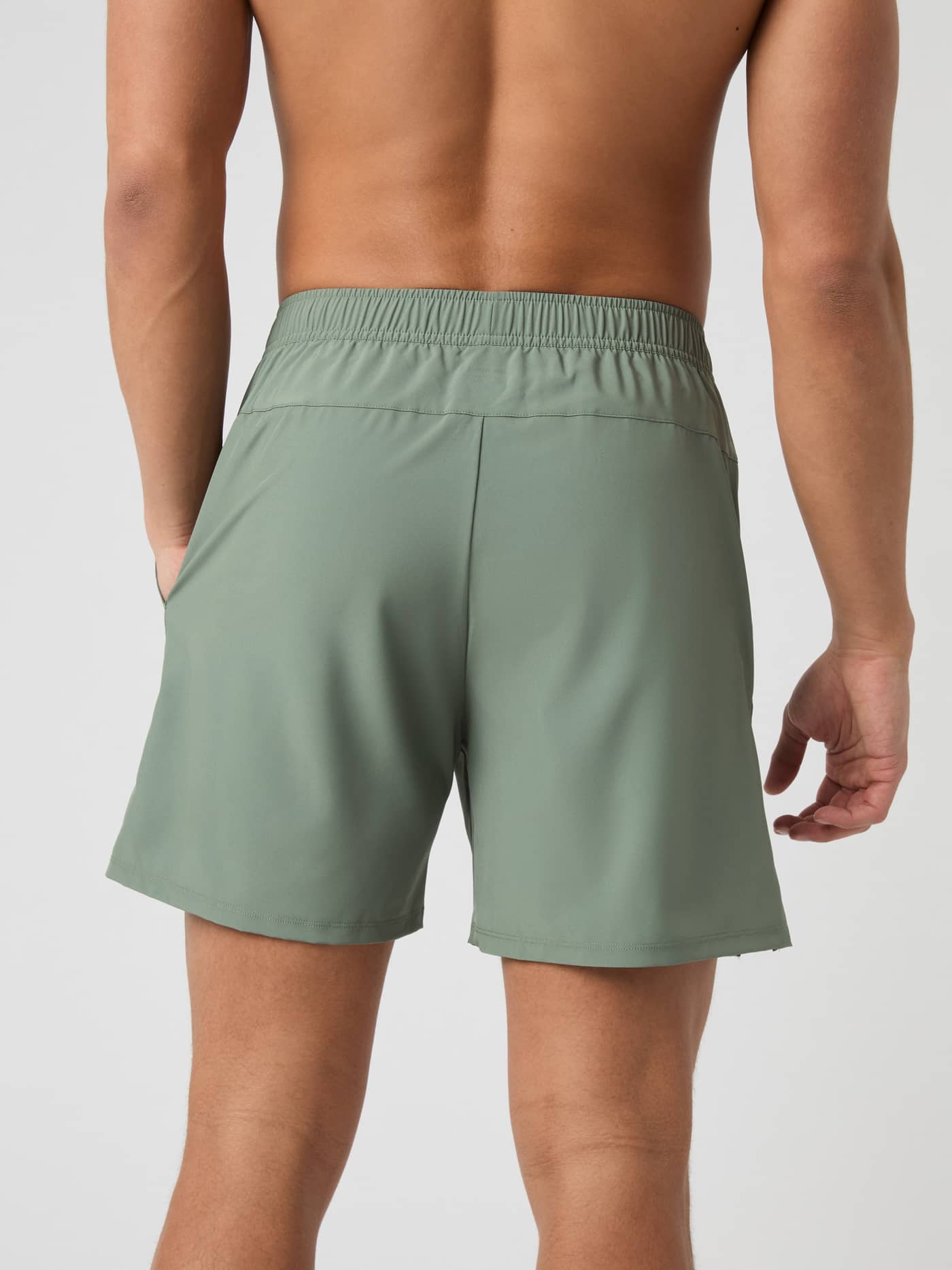Back view of a man wearing the Björn Borg Ace Racquet Shorts in Agave Green. - Image 3