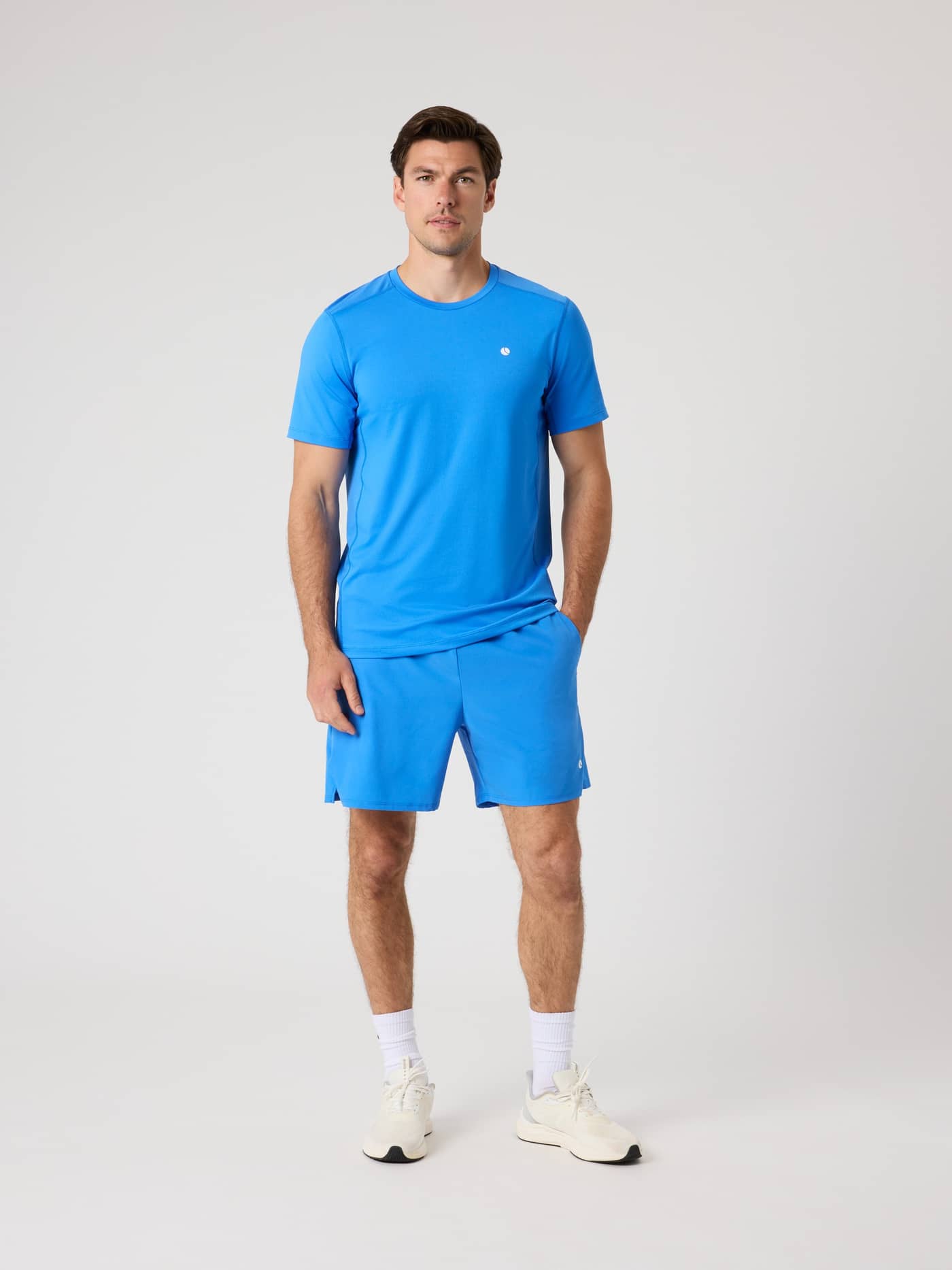 Full-body front view of a man wearing the Björn Borg Ace Racquet Shorts 7 Inch in Palace Blue (Blue) for tennis. - Image 3