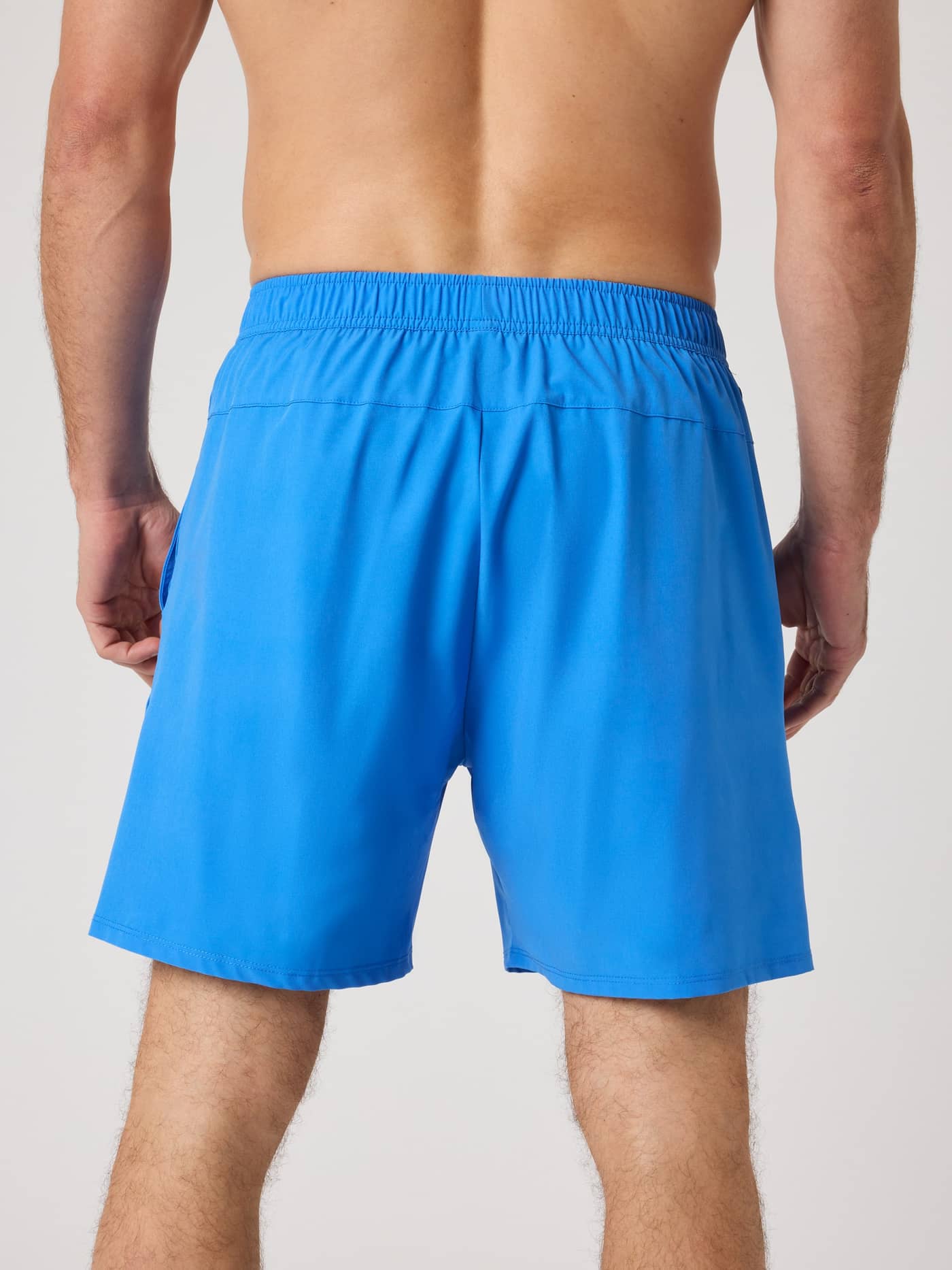 Back view of a model wearing the Björn Borg Ace Racquet Shorts 7 Inch in Palace Blue (Blue) for tennis performance. - Image 2
