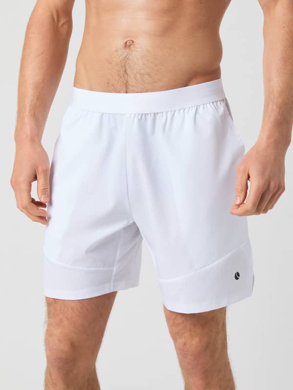 Front view of a man wearing stylish, functional Björn Borg Ace Pro Shorts 7 Inch in Brilliant White (White) for tennis.