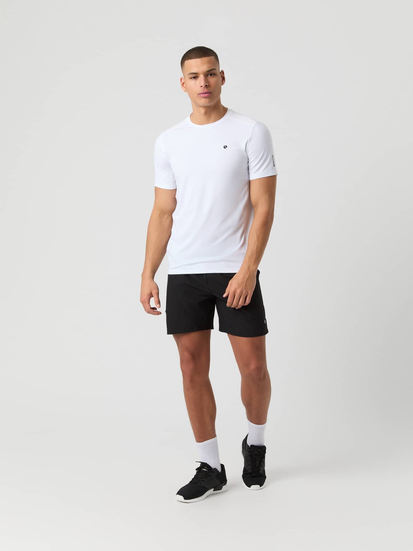 Full-body front view of a man wearing the Björn Borg Ace Pro Shorts 7 Inch in Black Beauty (Black) for tennis. - Image 3