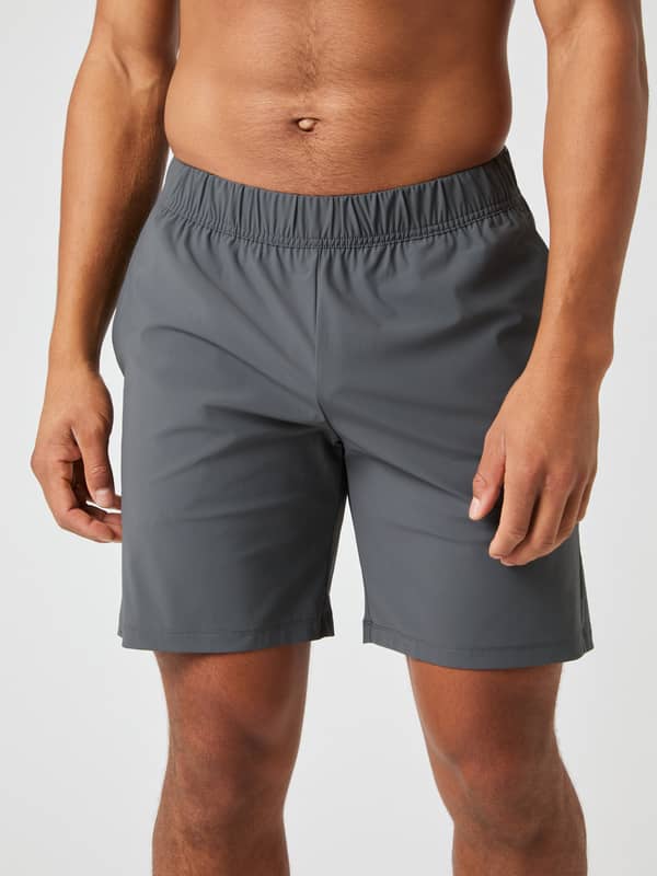 Close-up front view of a model wearing the Björn Borg Ace Sports 8" Shorts in Asphalt grey.