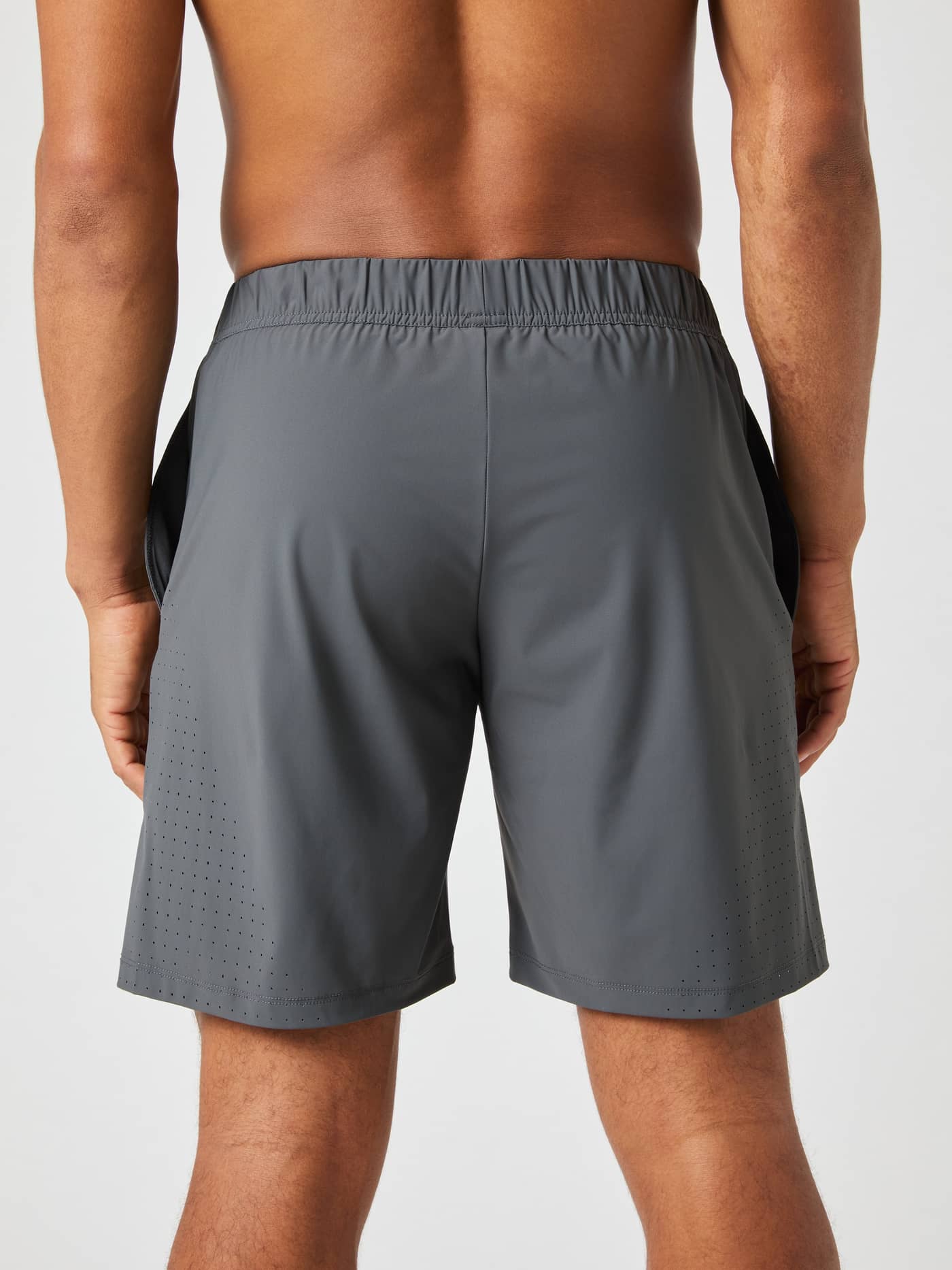 Back view of a model wearing the grey Björn Borg Ace Sports 8-inch Shorts. - Image 2