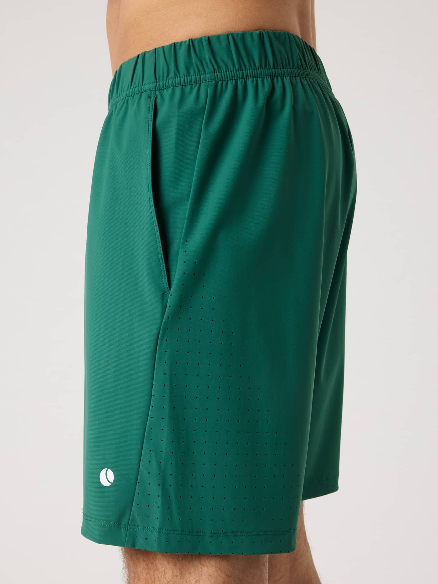 Side view of the Björn Borg Ace Sports Shorts 8 Inch in Posy Green (Green) with white tennis ball logo and perforated detail. - Image 5