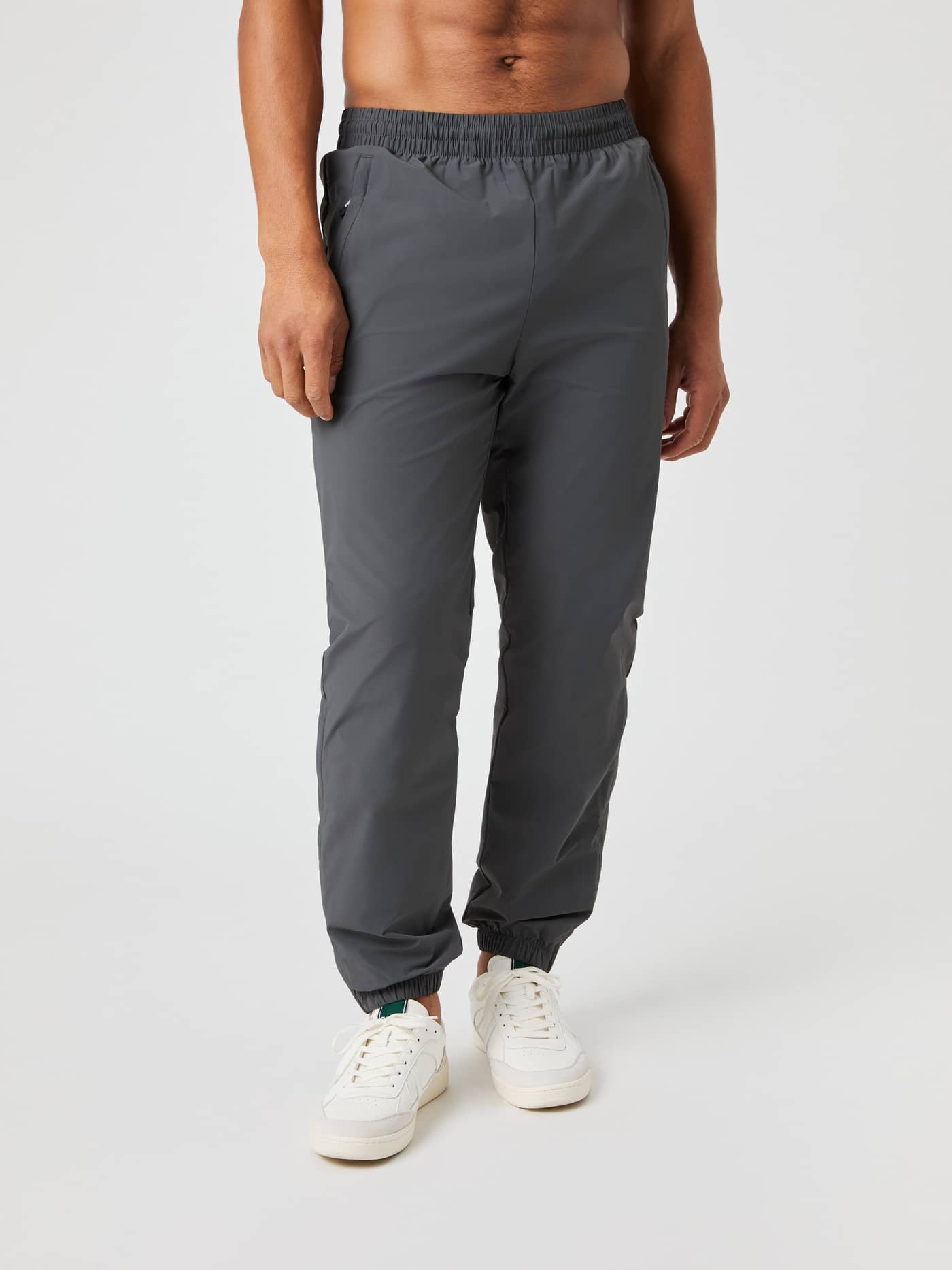 Front view of a man wearing the Björn Borg Ace Track Pants in Asphalt (Grey), designed for tennis and performance. - Image 2