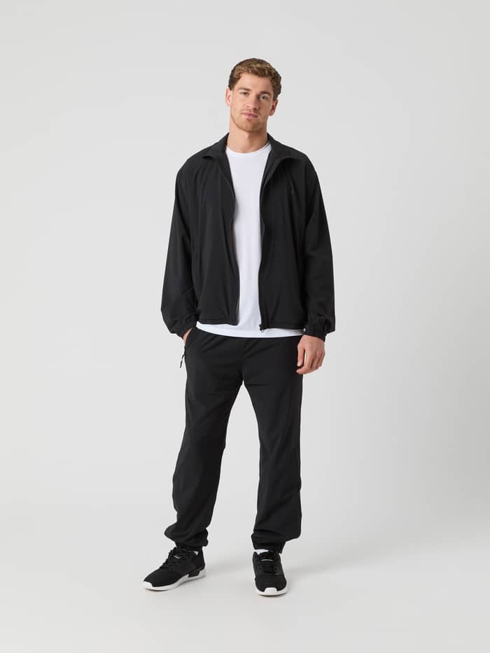 Full-body front view of a man wearing the Björn Borg Ace Track Jacket in Black Beauty (Black) for tennis performance. - Image 3