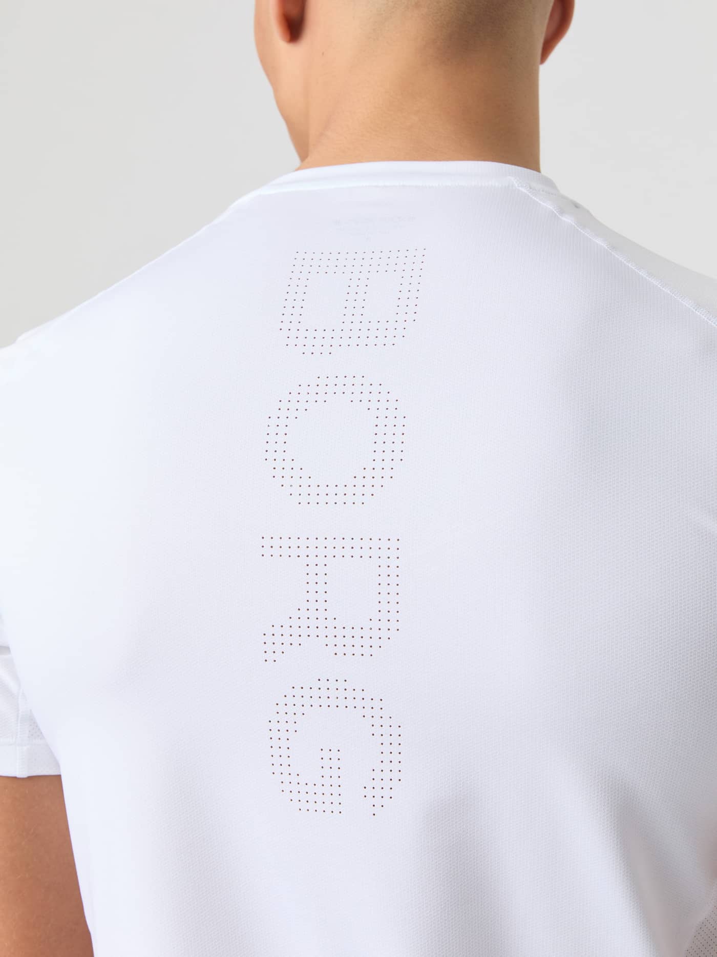 Detailed back view of the Ace Mesh Panel T-Shirt in Brilliant White (White), featuring a perforated BORG logo for tennis. - Image 4