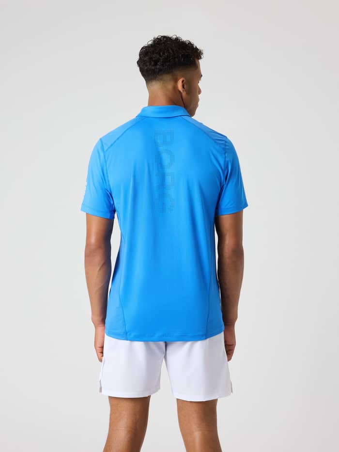 Back view of a man wearing the Björn Borg Ace Mesh Panel Polo Shirt in Palace Blue (Blue) with a perforated logo for tennis. - Image 2
