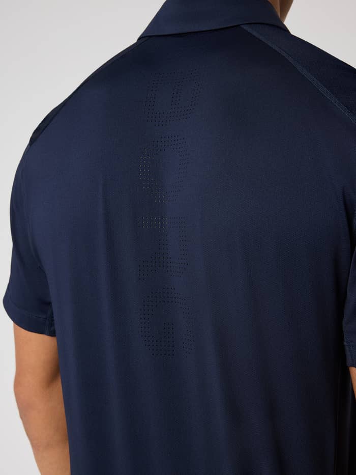 Back view of the men's Ace Mesh Panel Polo Shirt in Night sky (Navy) featuring a perforated logo for tennis performance. - Image 4