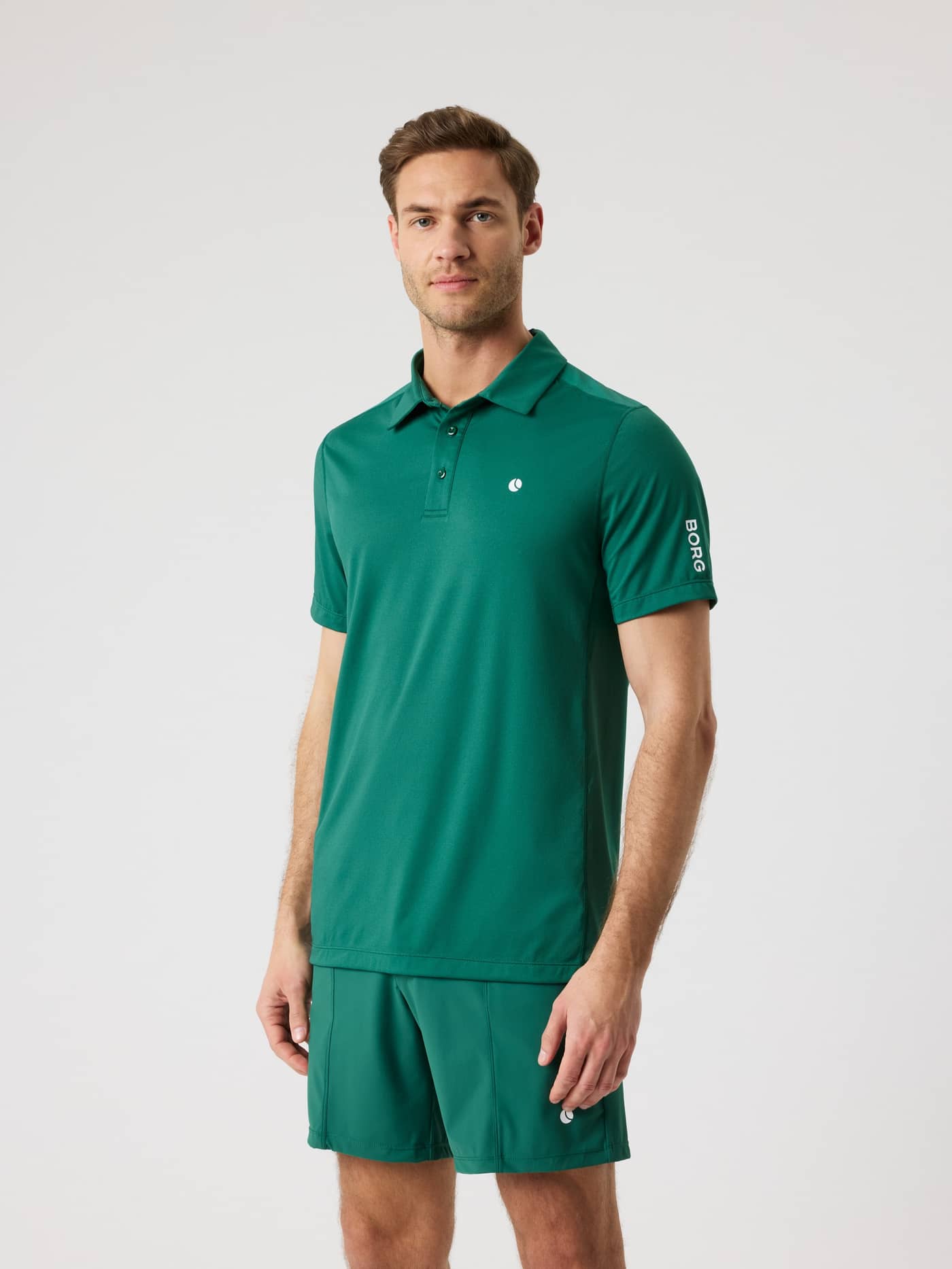 Front view of a model wearing the breathable Ace Mesh Panel Polo Shirt in Posy Green (Green) for tennis performance. - Image 1