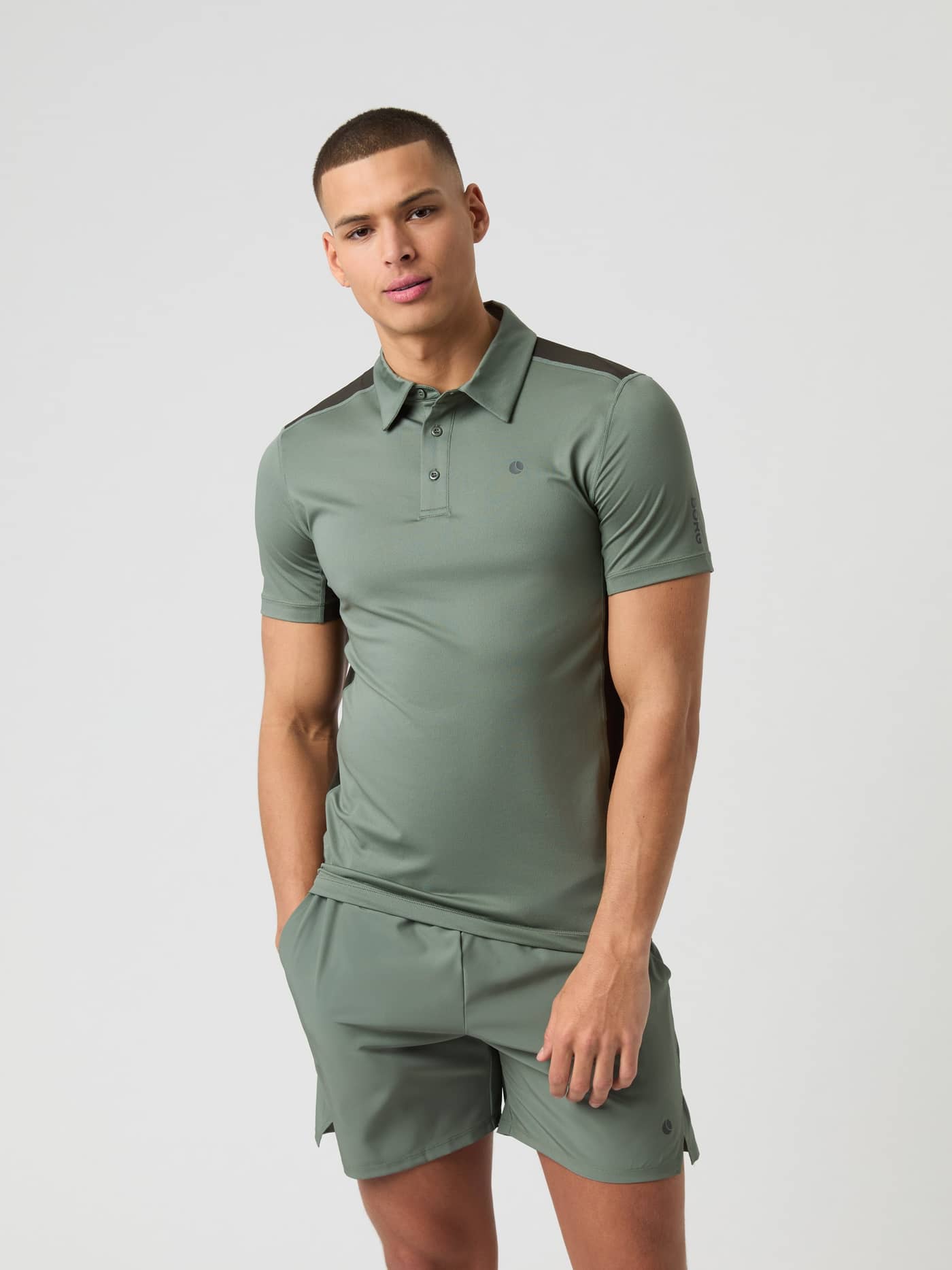 Front view of a man wearing the Björn Borg Ace Mesh Panel Polo Shirt in Agave Green (Green) for tennis performance. - Image 1