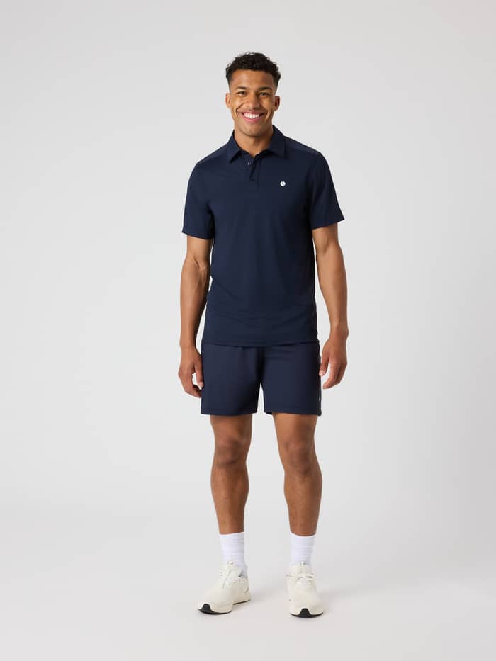 Full-body front view of a man wearing the Björn Borg Ace Mesh Panel Polo Shirt in Night sky (Navy) for tennis. - Image 3