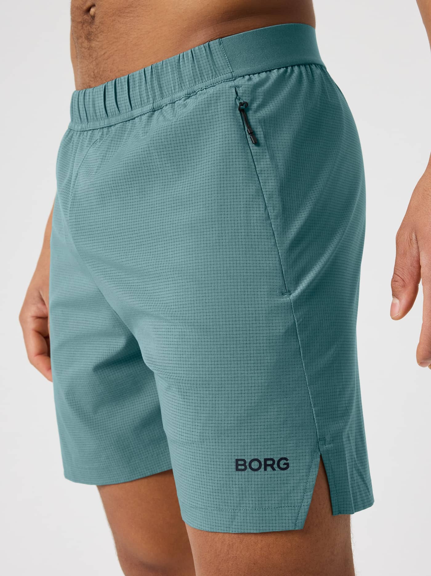 Balsam Green (Green) Björn Borg Zip Shorts 7 Inch for men's training, side view showing technical jacquard and a black logo. - Image 4