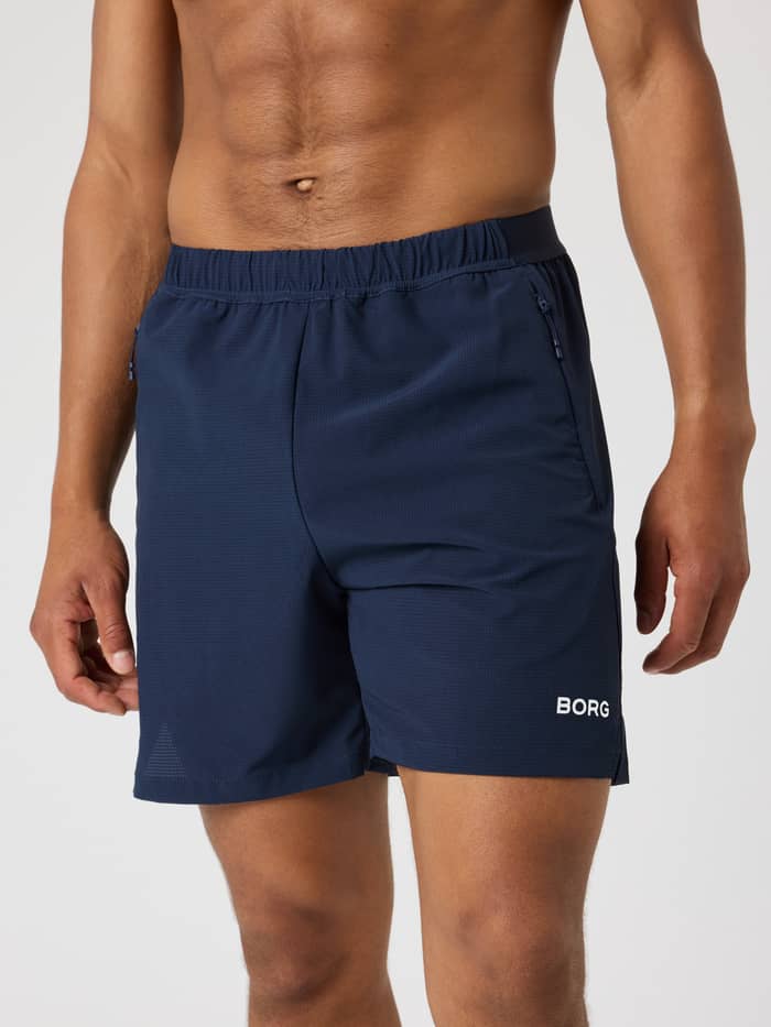 Night Sky (Marinblå) Borg Zip Shorts 7 Inch för herrar sedda framifrån med vit logotyp för funktionell träning.