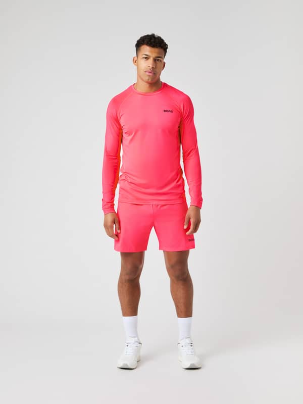 Borg Zip Shorts 7 Inch i Diva Pink (Rosa) på en modell sedd framifrån med matchande topp, perfekt för träning.