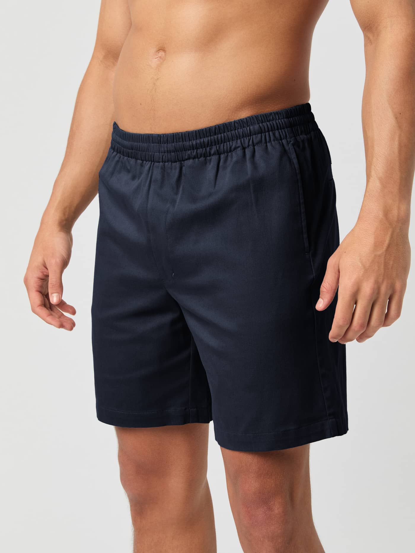 Front view of a man wearing the Björn Borg Centre Woven Drawstring Shorts in Night sky (Navy) with an elastic waist. - Image 2