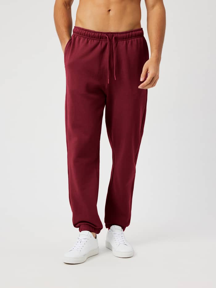 Borg Classic Sweatpants in Cabernet (Red) featuring an elastic drawstring waist and side pockets for everyday wear.