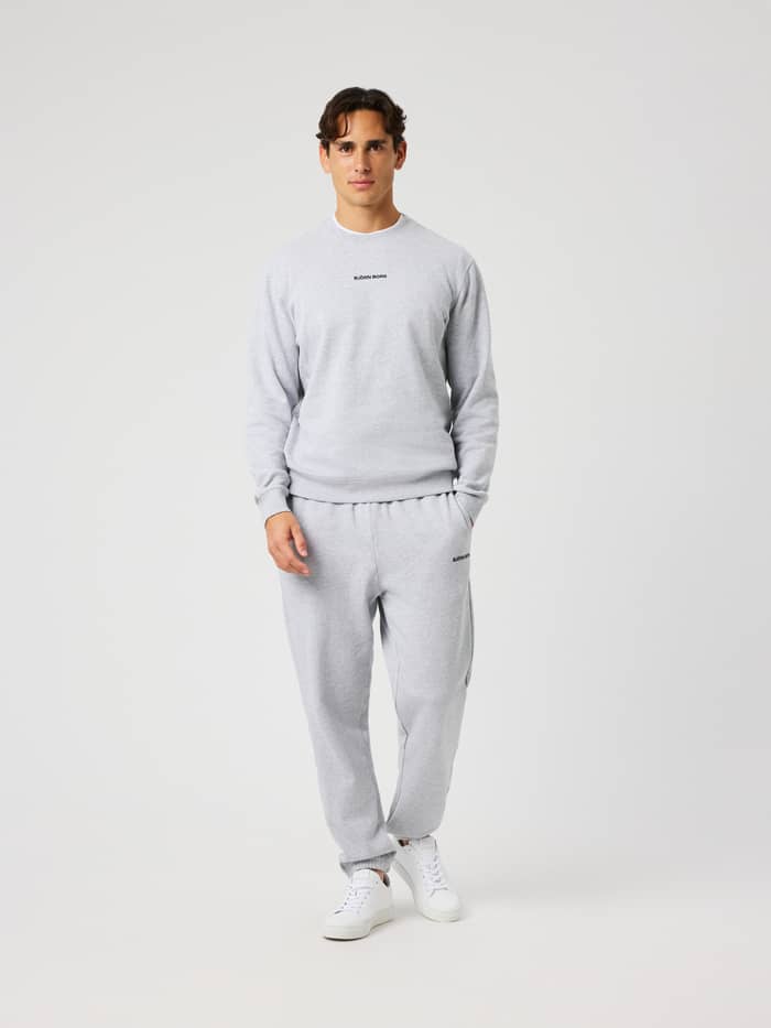 Man wearing Borg Classic Sweatpants in Ultra Light Grey Melange (Grey) for everyday comfort.