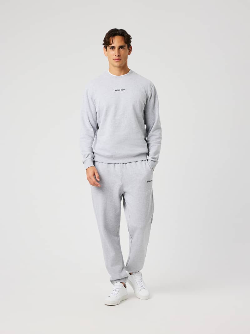 Man wearing Borg Classic Sweatpants in Ultra Light Grey Melange (Grey) for everyday comfort.
