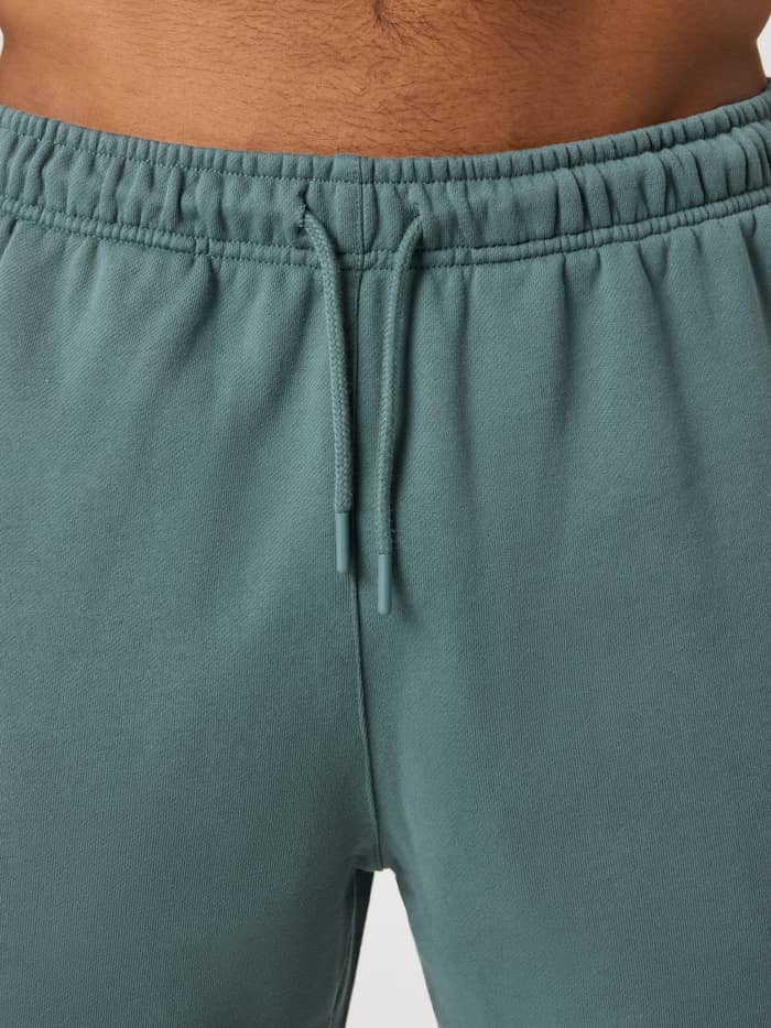 Close-up of the ribbed waistband and drawstring on the cotton Borg Classic Sweatshorts in Balsam Green (Green). - Image 5