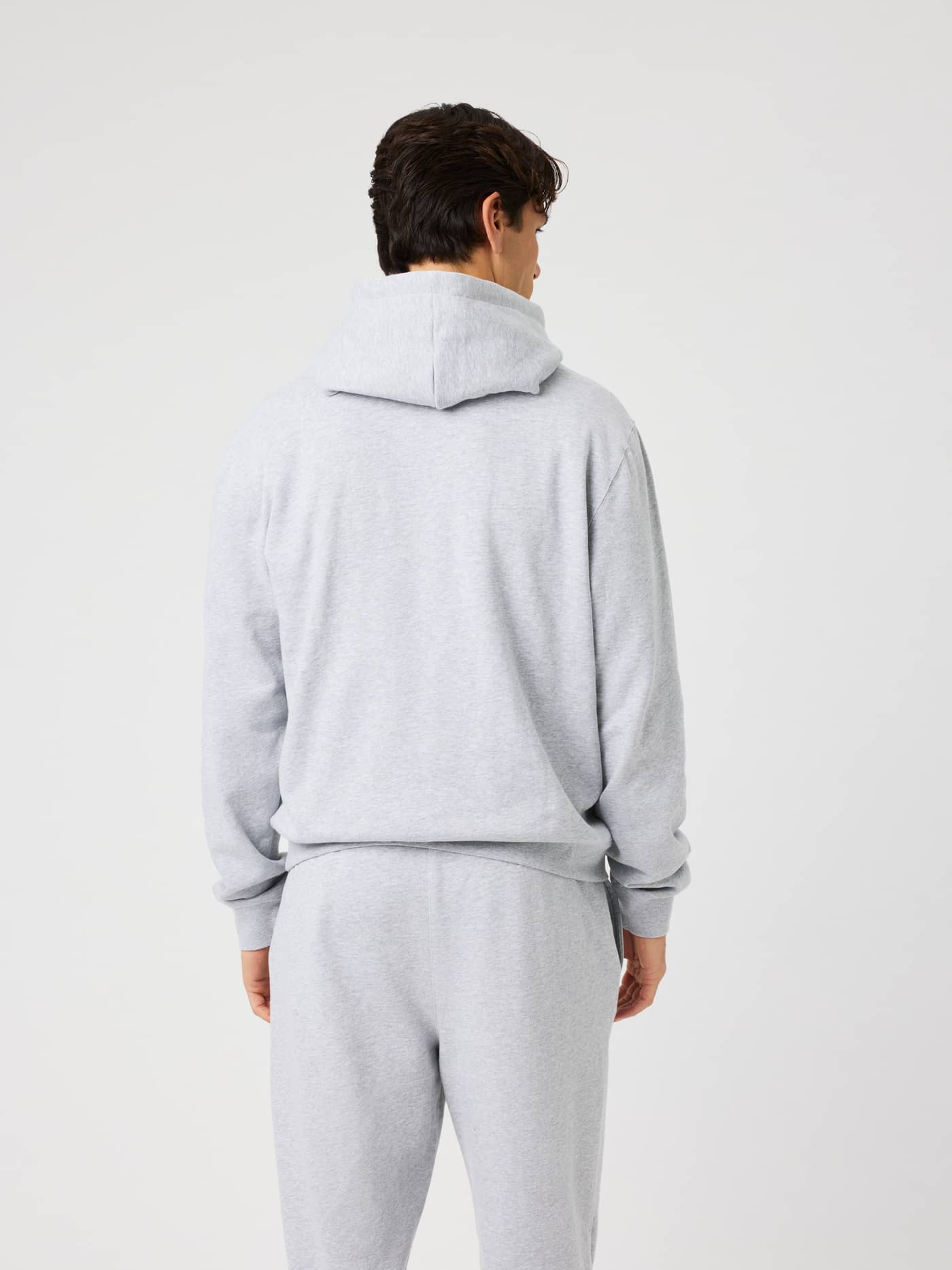 Back view of the Borg Classic Hoodie in Light Grey Melange (grey) showcasing the double-layer hood. - Image 3