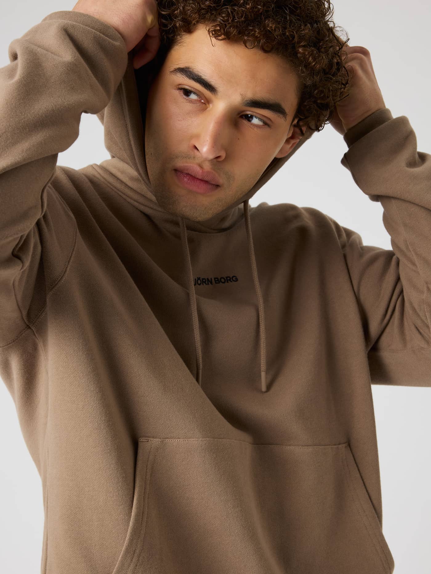 Borg Classic Hoodie in Caribou (Brown) with a black logo, made from soft cotton for training and everyday movement. - Image 5