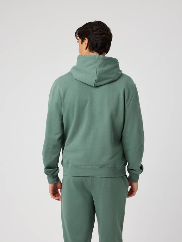 Back view of the Borg Classic Hoodie in Laurel Wreath (green) showing the double-layered hood and regular fit.