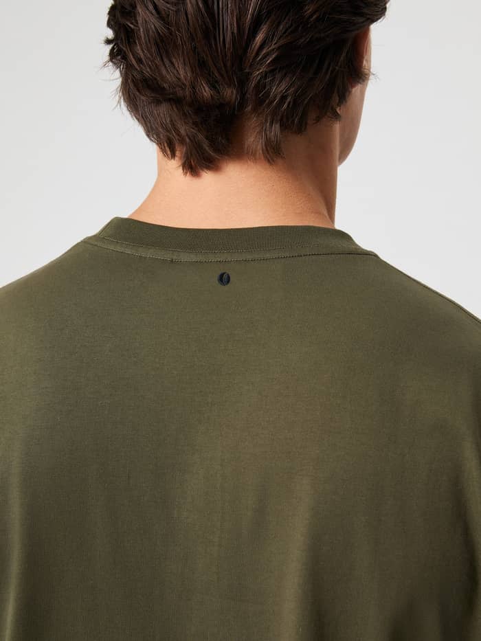 Close-up back view of the Björn Borg Classic T-Shirt in Forest Night (Green) featuring a small tennis logo. - Image 4