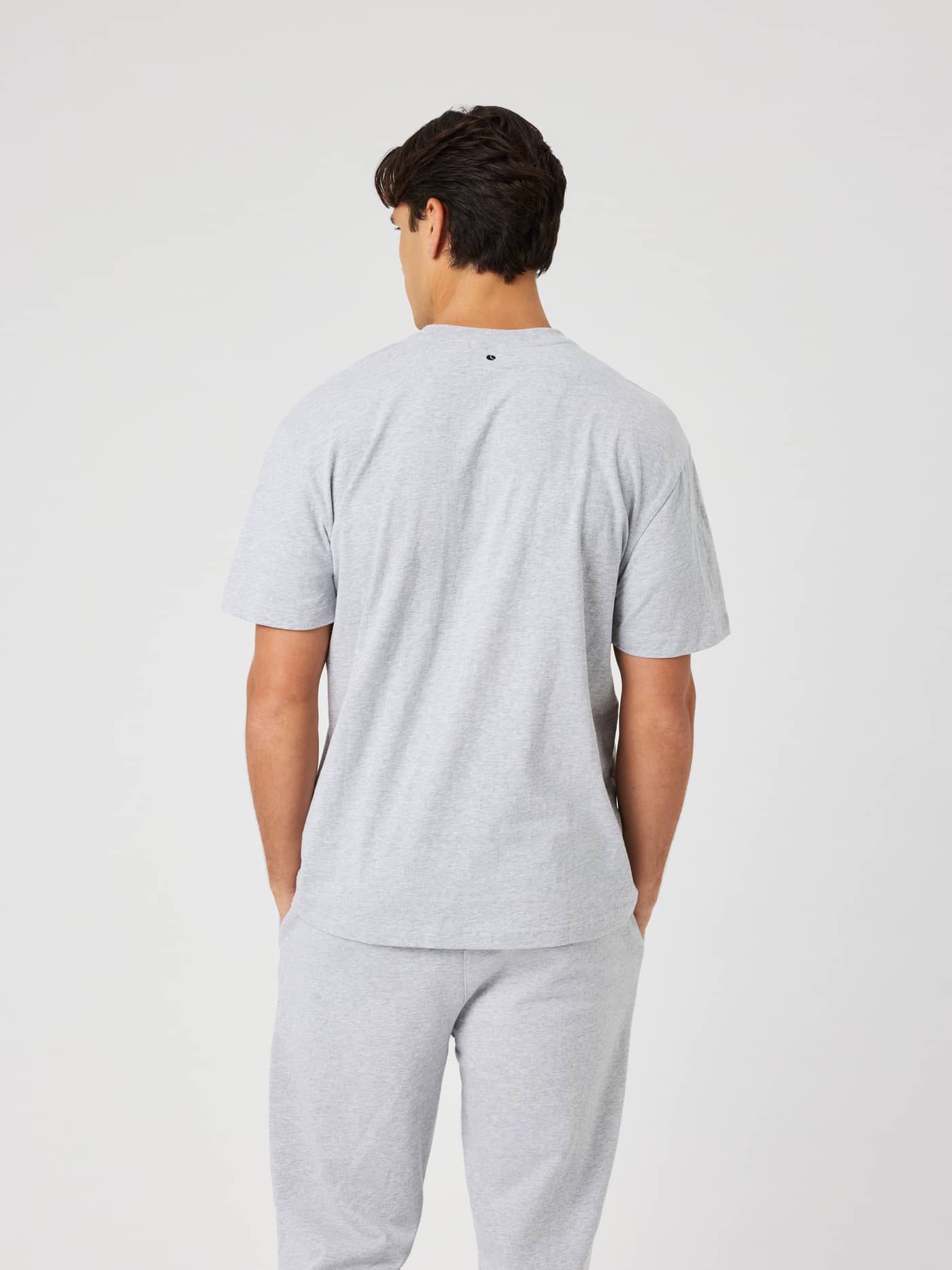 Back view of the Borg Classic T-Shirt in Light Grey Melange (grey) showcasing the embroidered tennis ball logo. - Image 3