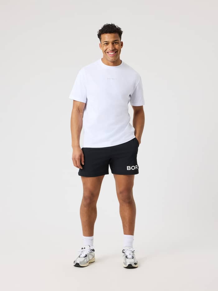 Full-body front view of a man in the 100% cotton Borg Classic T-Shirt in Brilliant White (White) with a white logo.