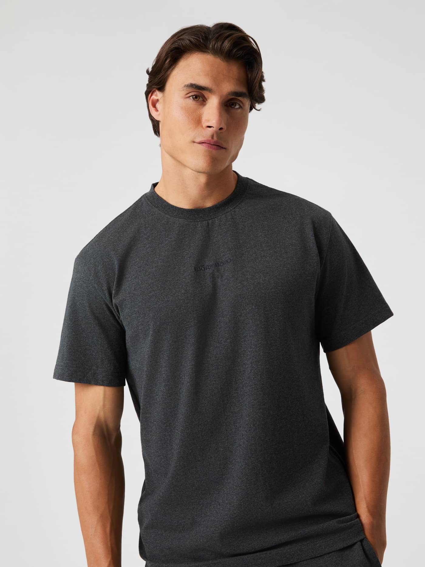 Front view of a man wearing the cotton Björn Borg Classic T-Shirt in Dark Gray Melange (Grey) for functional style and fit. - Image 4