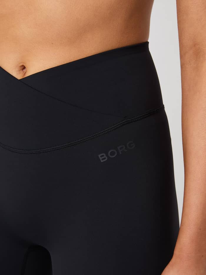 Close-up of the Studio Cross Shorts in Black Beauty (Black) with an overlap waistband and tonal black BORG logo for training. - Image 4