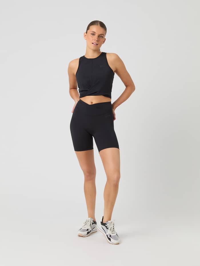 Full-body front view of a woman wearing high-waisted Björn Borg Studio Cross Shorts in Black Beauty (Black) for training. - Image 3