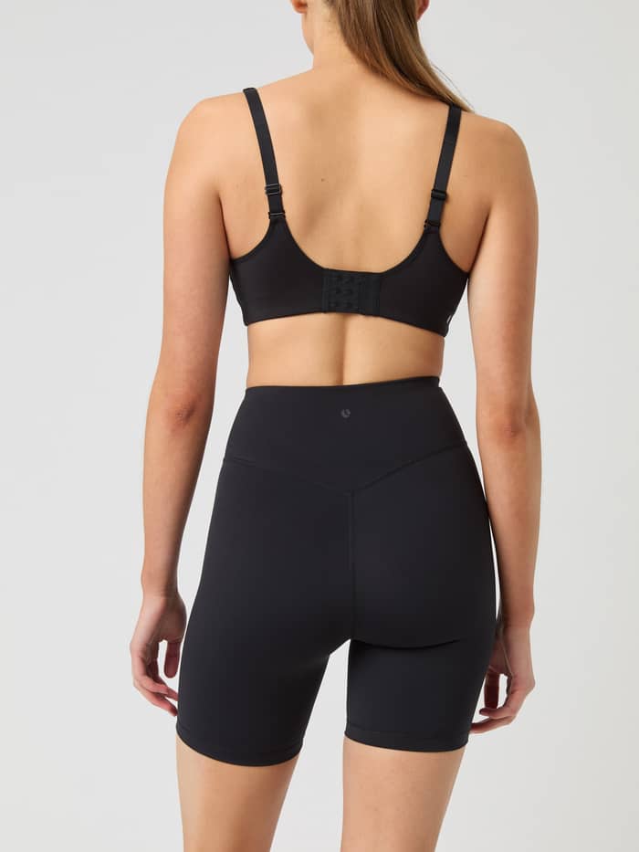 High-waisted Studio Cross Shorts in Black Beauty (Black) shown from the back, offering a stylish fit for training. - Image 2