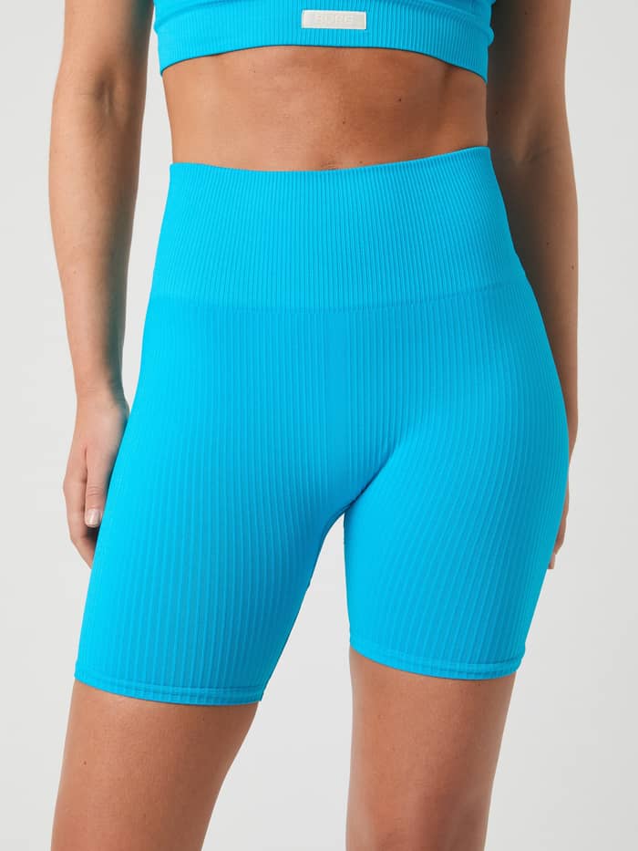 Front view of Atomic Blue (Blue) Studio Seamless Ribbed Shorts, with a high-waisted seamless fit for training. - Image 3