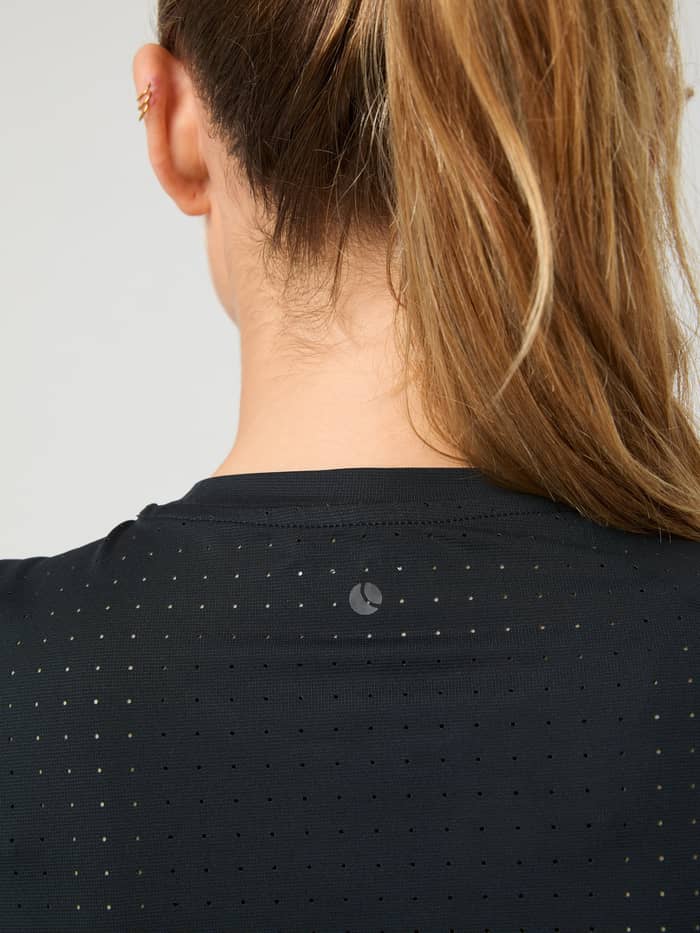 Back close-up of the Borg Performance Perforated T-Shirt in Black Beauty (Black) for running and training with a tonal logo. - Image 5