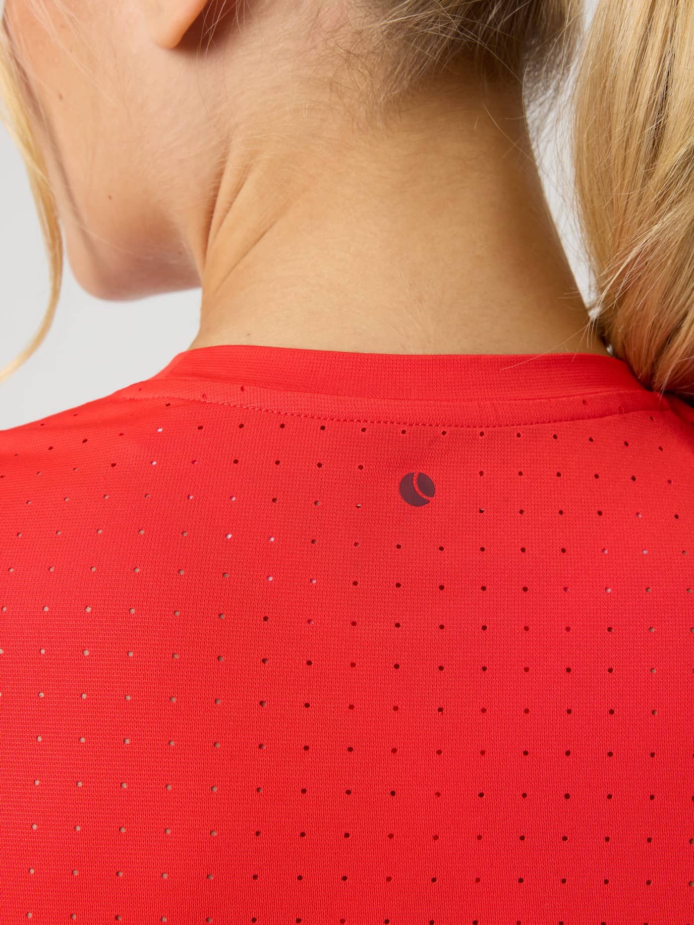 Back view of Borg Performance Perforated T-Shirt in Flame Scarlet (Red) with perforated running fabric and red tennis logo. - Image 4