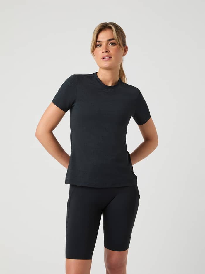 Front view of a model wearing the Borg Performance Perforated T-Shirt in Black Beauty (Black) for running and training.