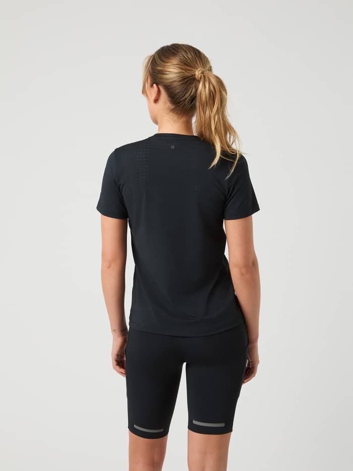 Back view of a model wearing the Borg Performance Perforated T-Shirt in Black Beauty (Black) for a stylish running fit. - Image 2