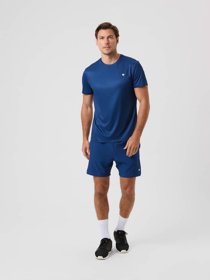Front view of a model wearing the Björn Borg Ace Light T-shirt in Estate Blue.