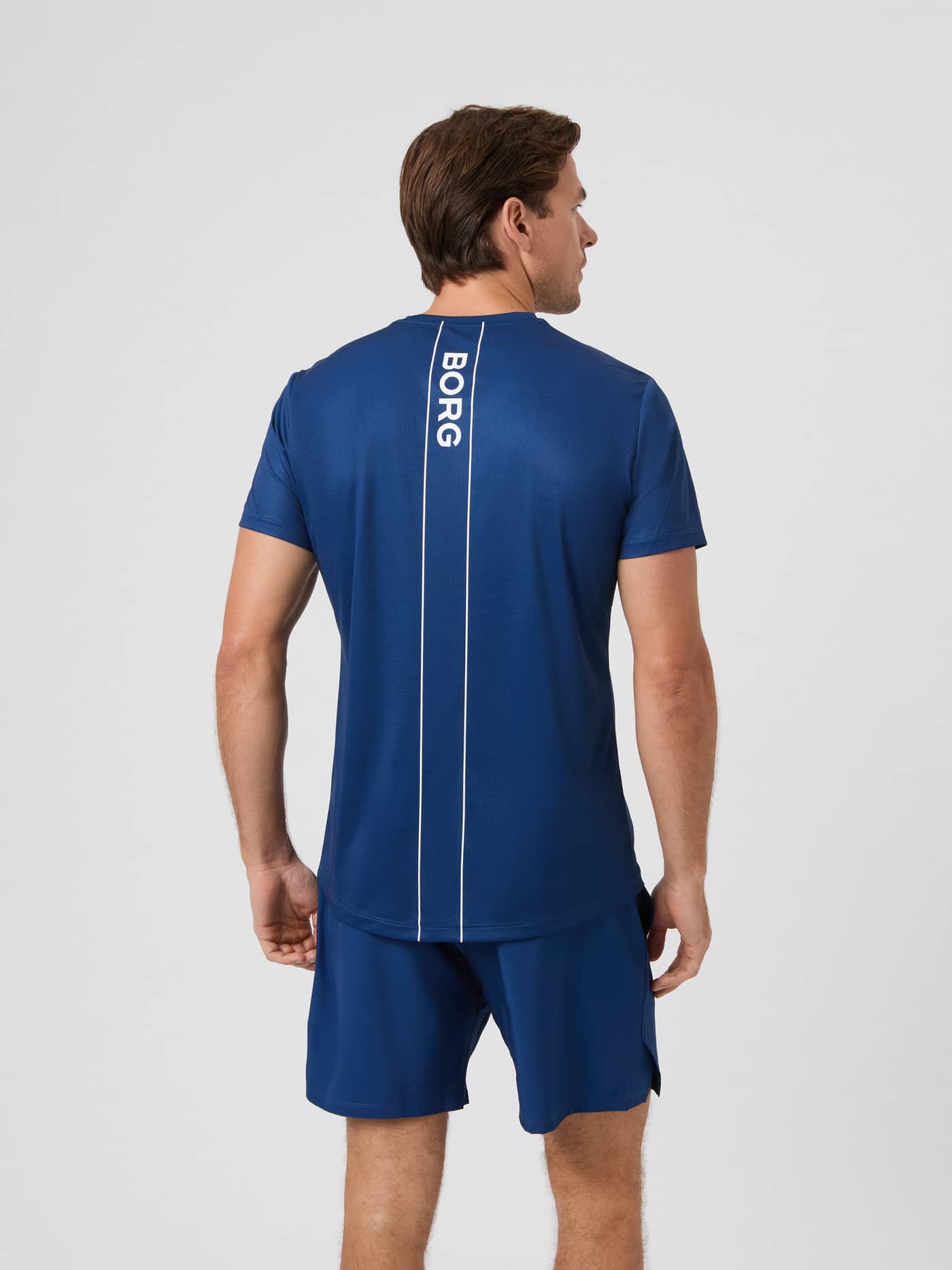 Back view of a model wearing the Björn Borg Ace Light T-shirt in Estate Blue. - Image 2