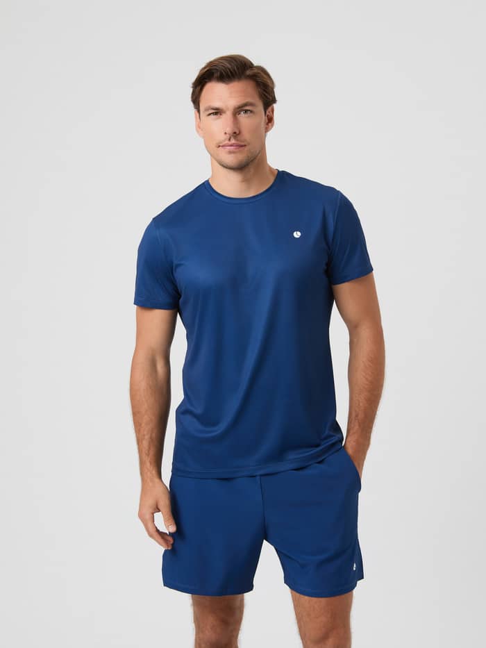 Front view of a model wearing the Estate Blue Björn Borg Ace Light T-shirt and matching shorts.
