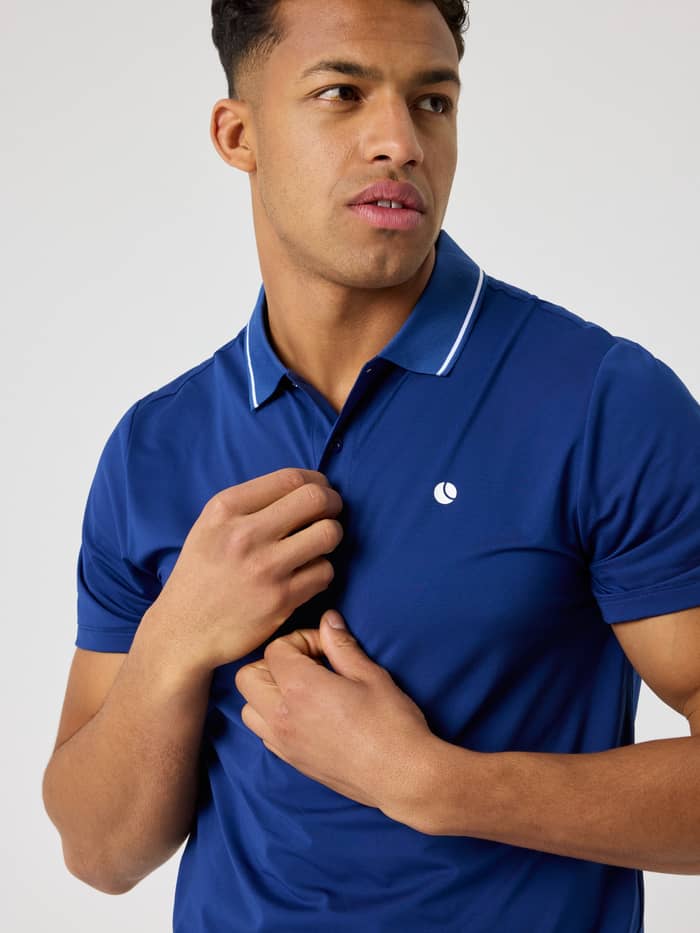 Björn Borg Ace Polo Shirt in Blue Depths (Blue) featuring a white tennis ball logo, designed for tennis performance.