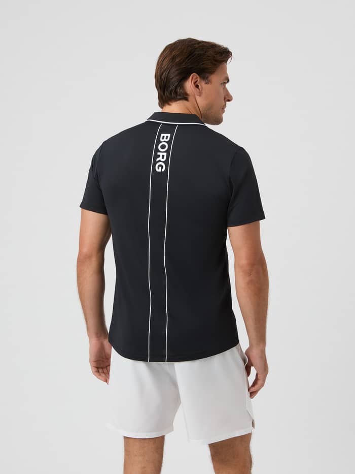 Back view of the black Björn Borg Ace Polo Shirt on a model, showing the vertical BORG logo. - Image 2