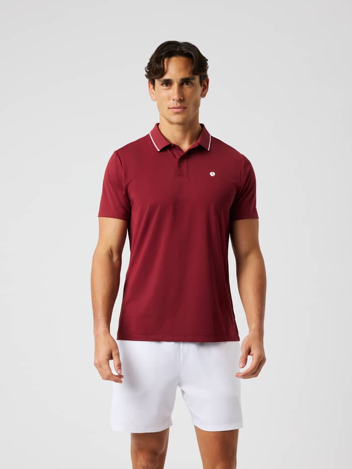 Front view of a man wearing the Björn Borg Ace Polo Shirt in cabernet red for tennis.